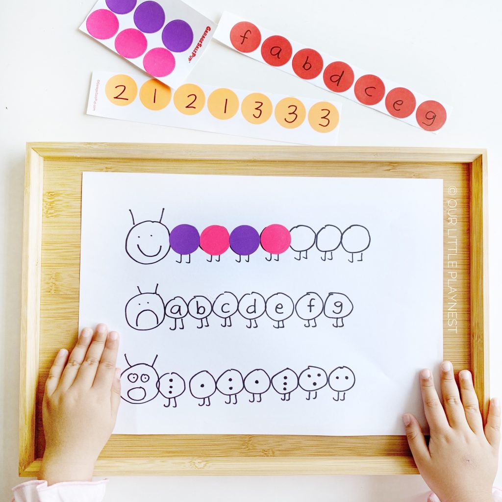 creating caterpillar with dot stickers while learning mathematics and letters of the alphabet