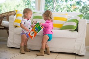 Toddler tantrums and child behavior - image of a toddler not sharing